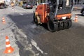 Vibrating road roller repairs the road section on a city street Royalty Free Stock Photo