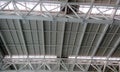 Heavy weight structural steel roof or double height ceiling of an Airport Building interior at chennai international airport with