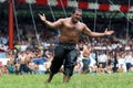 A heavy weight wrestler celebrates victory during competition at the Kirkpinar Turkish Oil Wrestling Festival in Edirne in