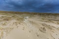 Heavy Wester storm to Dutch North Sea coast blows foam caused by surf breakers Royalty Free Stock Photo