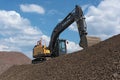 Heavy wheel loader excavator on a rocky hill