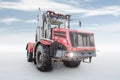 Heavy wheeled tractor isolated on bright background with sky