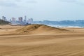 Heavy Wind Blowing Sand on Beach Against City Skyline Royalty Free Stock Photo