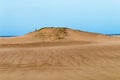 Heavy Wind Blowing Sand on Beach Against Coastal Skyline Royalty Free Stock Photo