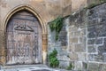 Massive wooden door with an iron lock in the architecture of Medieval Europe Royalty Free Stock Photo