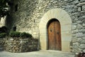 Heavy wooden, riveted door