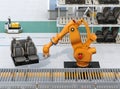 Heavyweight robotic arm carrying car seats in car assembly production line Royalty Free Stock Photo