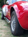 Side view of the exhaust and wheels of a rare Vintage AC Cobra Sports Car on display at the Annual Hebden Bridge Vintage Weekend p Royalty Free Stock Photo