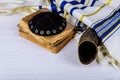 The Hebrew handwritten Torah, shofar ram& x27;s horn on a synagogue alter, with Kippah and Talith Royalty Free Stock Photo