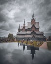 Heddal stave church, an old Scandinavian Viking building, and its reflection in Norway, vertical