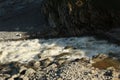 Heddon& x27;s river rushing out to sea at Heddon& x27;s mouth Royalty Free Stock Photo