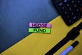 Hedge Fund text on top view color table background