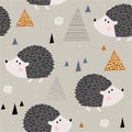 Colorful seamless pattern with happy hedgehogs. Decorative cute background with funny animals