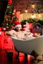 Hedonism concept. Stunning winter views enjoyed from bathtub. Apartment with bathtub. Man celebrate new year lying in