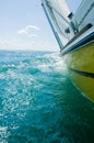 A heeling yellow sailboat Royalty Free Stock Photo