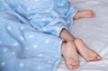 Heels and toes on bed. Heels and feets. Children`s feet. Barefeet on the bed. Kid`s feet in bed. Kids taking a rest Royalty Free Stock Photo