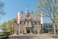 Early 19th century town hall, with trees an a blue sky