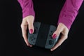 Top view of woman hands with pink nail polish on fingers holding a Nintendo Switch gaming controller for video games Royalty Free Stock Photo