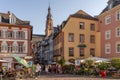 Heidelberg, Germany - Aug 1, 2020: Hustling street with view of bell tower of heiliggeistkirche