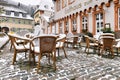 Heidelberg, Germany - Empty tables with chairs covered in snow in front of outdoor restaurant