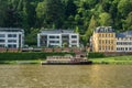 HEIDELBERG, GERMANY - JUNE 4, 2017: An ambankment of a Neckar river with colorful houses and a ship