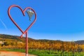 Heidelberg, Germany -  Herat shaped sculpture called `Love for wine` in front of vineyards in German Odenwald forest Royalty Free Stock Photo