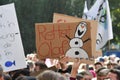 Protest sign with snowman saying `Safe Olaf` held up by young people during Global Climate Strike / Fridays for future
