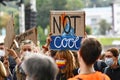 Heidelberg, Germany - September 2021: Sign held up by young woman saying `Not cool` at Global Climate Strike demonstration