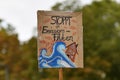 Heidelberg, Germany - September 2021: Sign saying `Stop emission floods` in German during Global Climate Strike demonstrati