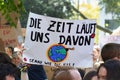 Demonstration during Global Climate Strike with banner held up saying `Time is running out` in German