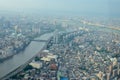 From a height of flight. River with bridges inside urban.