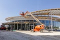 Height workers with help of cherry picker are working on new met