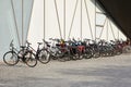 Heilbronn, Germany - August 12, 2019. Many bicycles are parked near the wall of a building in a town in Europe. Eco