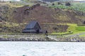 Heimaey, Westman Isles, Iceland. Wooden church in front of lava fields.