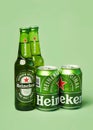 Heineken lager beer bottles and Heineken beer aluminum cans Royalty Free Stock Photo