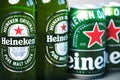 Heineken lager beer bottles and Heineken beer aluminum cans Royalty Free Stock Photo