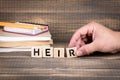 Heir concept. Wooden letters on the office desk Royalty Free Stock Photo