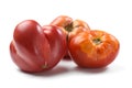 Heirloom fresh juicy tomatoes irregular in shape isolated