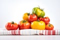 heirloom tomatoes piled on a white cloth Royalty Free Stock Photo