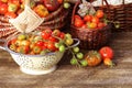 Heirloom variety tomatoes in baskets on rustic table. Colorful tomato - red,yellow , orange. Harvest vegetable cooking Royalty Free Stock Photo