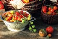 Heirloom variety tomatoes in baskets on rustic table. Colorful tomato - red,yellow , orange. Harvest vegetable cooking Royalty Free Stock Photo