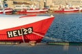 Hel, Poland - 08.01.2021: Shot of red and white fishing boat tied to pier on a beautiful sunny summer day with Baltic Royalty Free Stock Photo