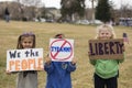 Helena, Montana - April 19, 2020: Children, young girls, holding liberty and tyranny sign at the protest rally at the Capitol due Royalty Free Stock Photo