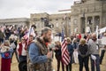 Helena, Montana - April 19, 2020: A man speaking and praying at a protest liberty rally at the Capitol again the shutdown due to