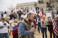 Helena, Montana - April 19, 2020: A man speaking and praying at a protest liberty rally at the Capitol again the shutdown due to