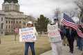 Helena, Montana - April 19, 2020: A man and a woman protesting and holding signs stating the governor does not protect adoptive