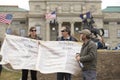 Helena, Montana - April 19, 2020: A man an woman protestor holding banners of the Bill of Rights in front of the Capitol building