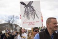 Helena, Montana - April 19, 2020: A Native American protestor holding sign that reads Government speaks with a forked tongue.
