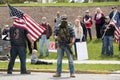 Helena, Montana - May 20, 2020: An armed man, militia member, protest at the Capitol building, holding a semi-automatic weapon in