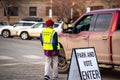 Helena, Montana / November 3, 2020: Woman poll worker helping voter at polling station, park vote in truck, presidential Election Royalty Free Stock Photo